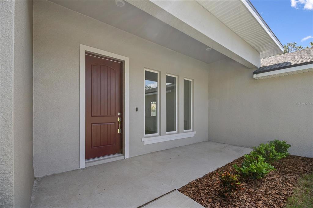 52 Pershing Lane Palm Coast, FL 32164 - Photo 7 of 37 a view of an empty room with window