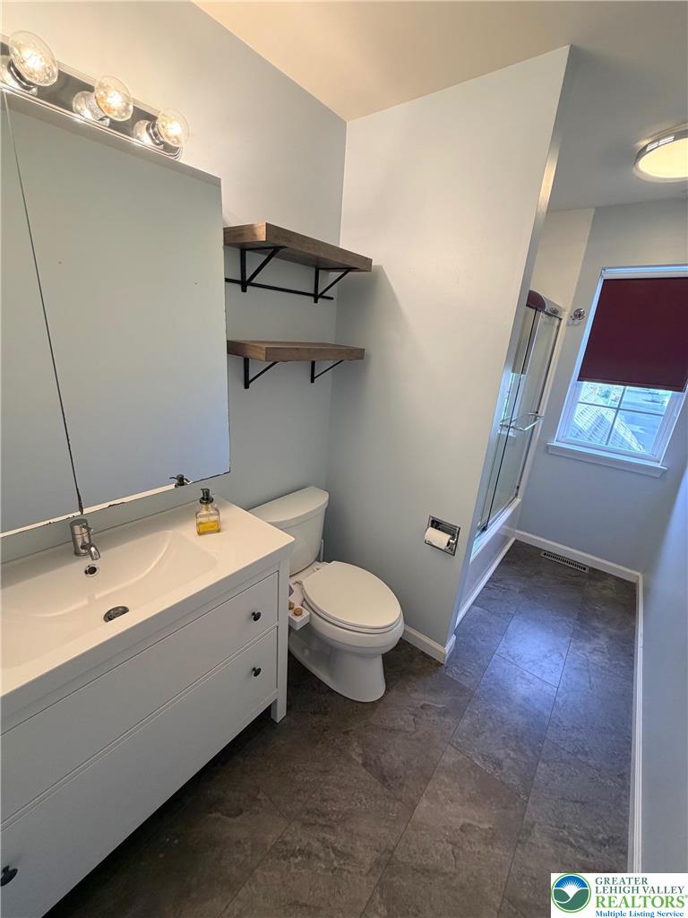 5598 North Coplay Road Whitehall, PA 18052 - Photo 22 of 33 a bathroom with a sink and mirror with toilet