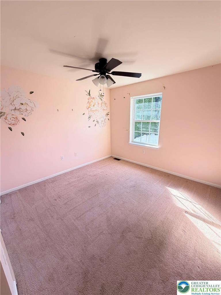 5598 North Coplay Road Whitehall, PA 18052 - Photo 24 of 33 an empty room with windows and fan