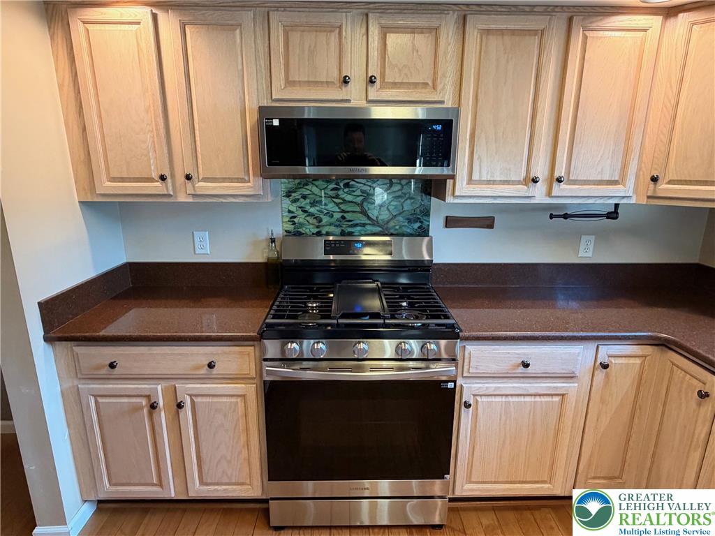 5598 North Coplay Road Whitehall, PA 18052 - Photo 10 of 33 a stove top oven sitting inside of a kitchen