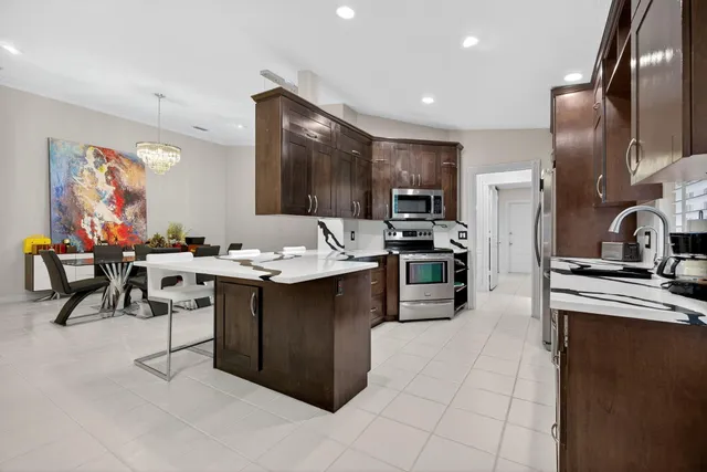 a kitchen with a sink window and cabinets
