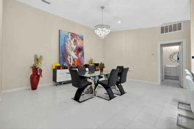 a kitchen with stainless steel appliances kitchen island granite countertop a sink and cabinets