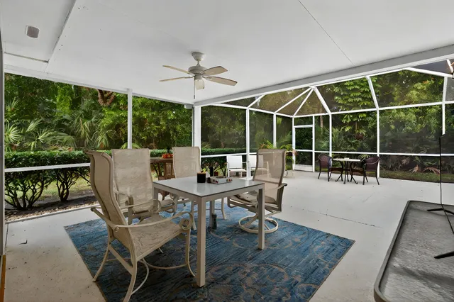 a dining room with furniture mountain view and a floor to ceiling window
