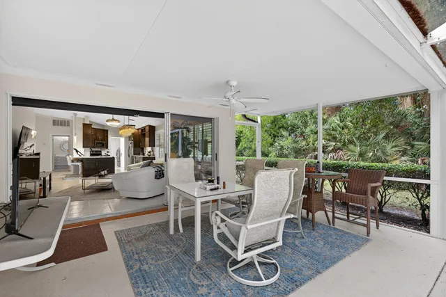 a view of a chairs and table in the patio