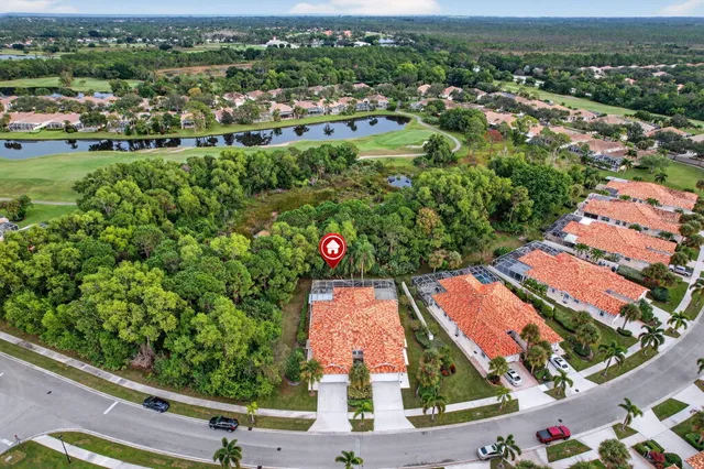 an aerial view of residential houses and outdoor space