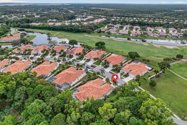 an aerial view of a houses with a lake view