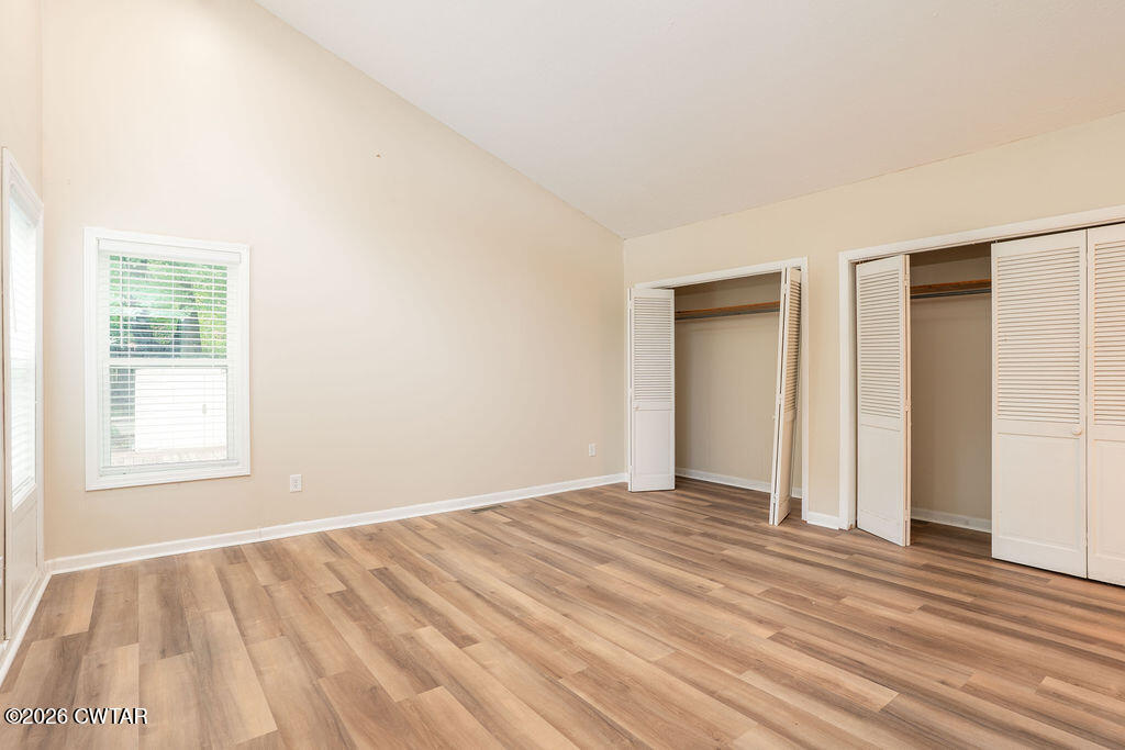 7 Timberlake Drive Jackson, TN 38305 - Photo 20 of 38 a view of an empty room with wooden floor and a window