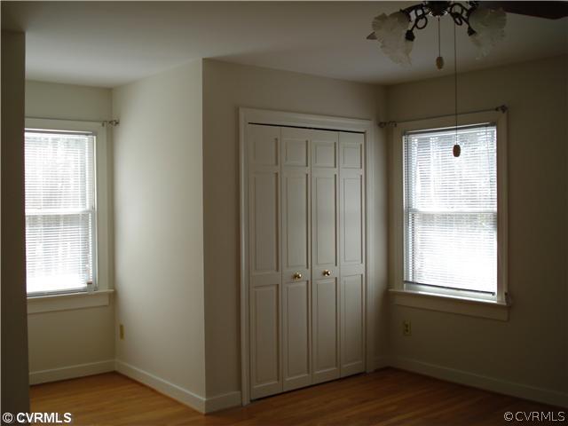 512 Fords Road Manakin-Sabot, VA 23103 - Photo 5 of 10 a view of an empty room with wooden floor and a window