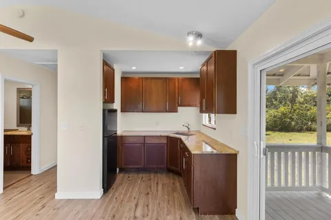 a kitchen with sink and cabinets