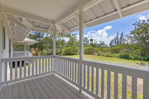 a view of a porch with wooden floor