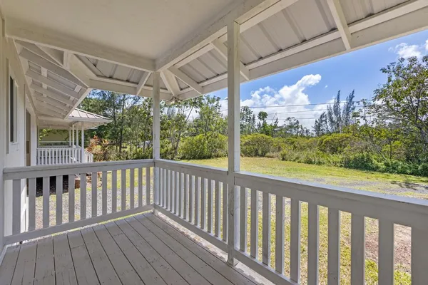 a view of a porch with wooden floor