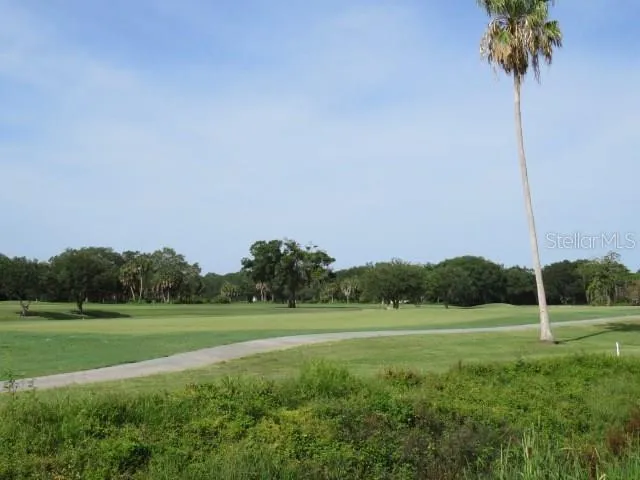 a view of a golf course with a garden