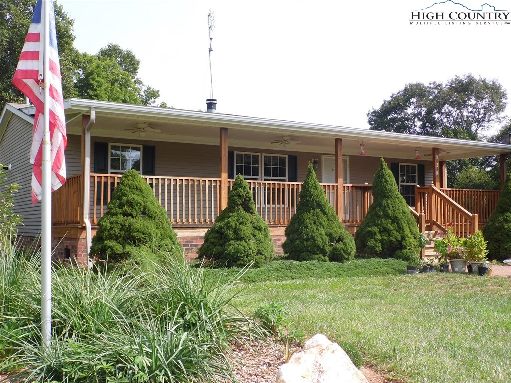 528 Stewart Road Ennice, NC 28623 - Photo 2 of 46 a front view of a house with garden