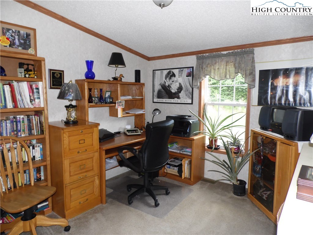 528 Stewart Road Ennice, NC 28623 - Photo 21 of 46 a workspace with furniture and window