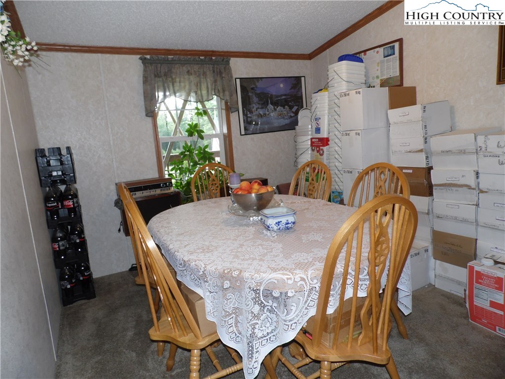 528 Stewart Road Ennice, NC 28623 - Photo 22 of 46 a dining room with furniture and window