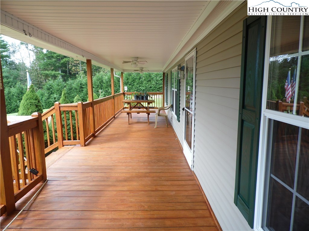 528 Stewart Road Ennice, NC 28623 - Photo 23 of 46 a view of two chairs in the balcony