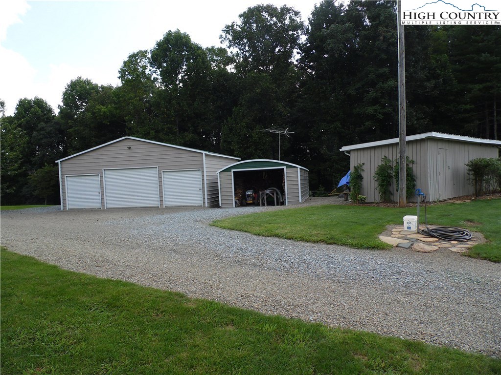 528 Stewart Road Ennice, NC 28623 - Photo 24 of 46 a front view of house with yard and green space