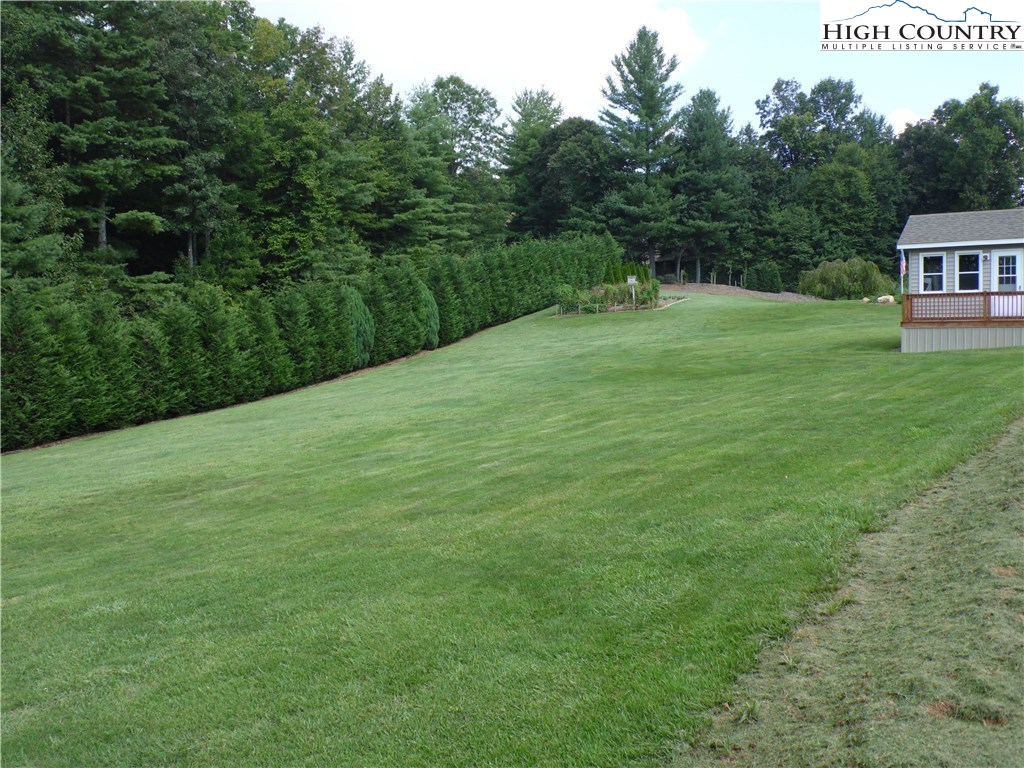 528 Stewart Road Ennice, NC 28623 - Photo 27 of 46 a view of a house with a yard