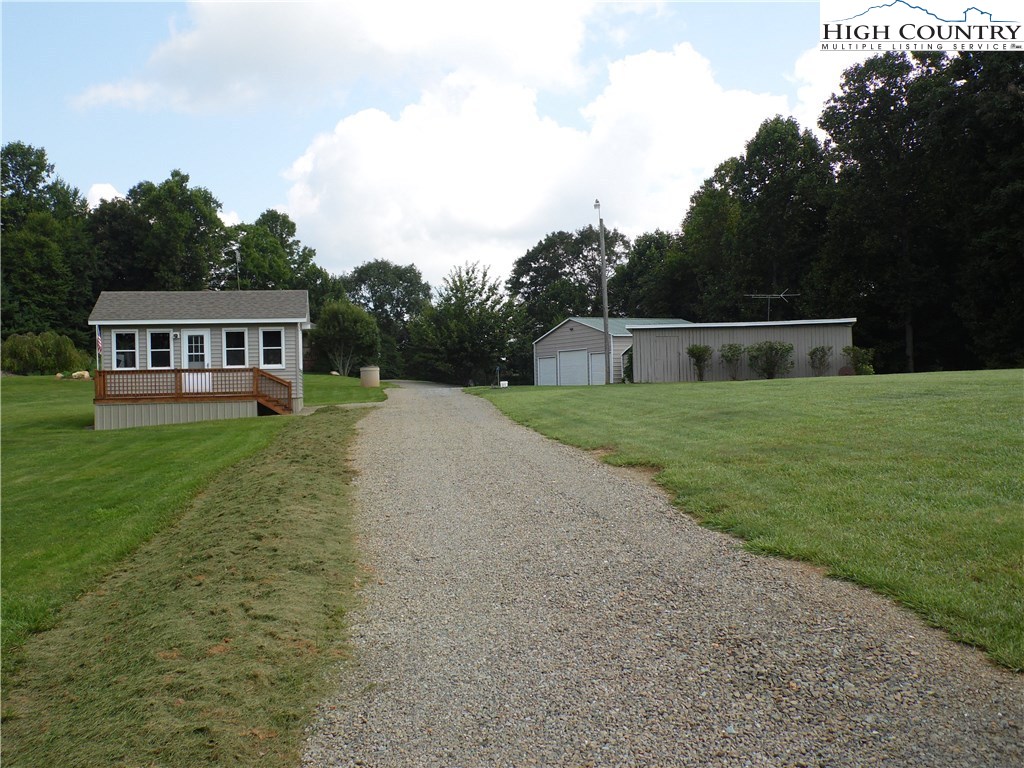 528 Stewart Road Ennice, NC 28623 - Photo 30 of 46 a view of a house with a big yard