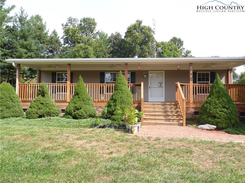 528 Stewart Road Ennice, NC 28623 - Photo 40 of 46 a front view of a house with a yard