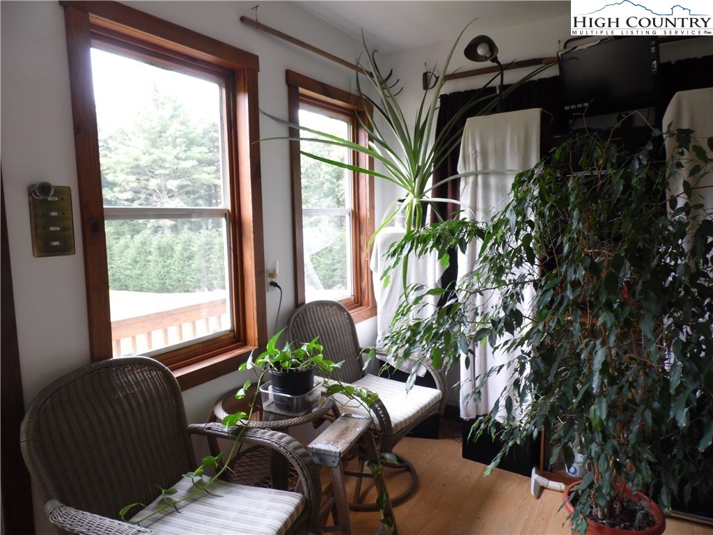 528 Stewart Road Ennice, NC 28623 - Photo 44 of 46 a living room with furniture and a potted plant