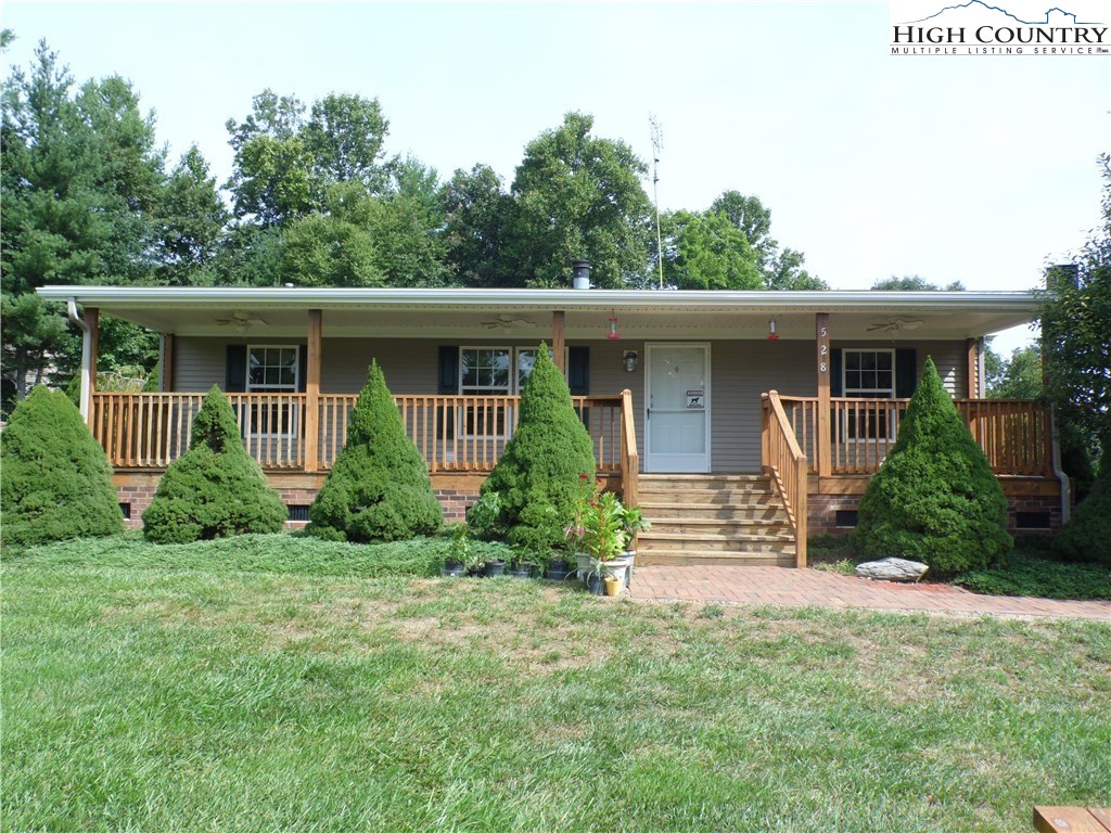 528 Stewart Road Ennice, NC 28623 - Photo 46 of 46 a front view of a house with a yard