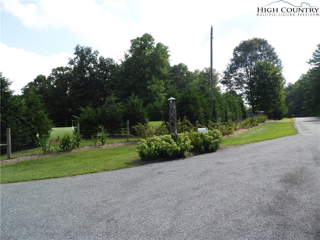 528 Stewart Road Ennice, NC 28623 - Photo 5 of 46 a view of a house with a yard and garage