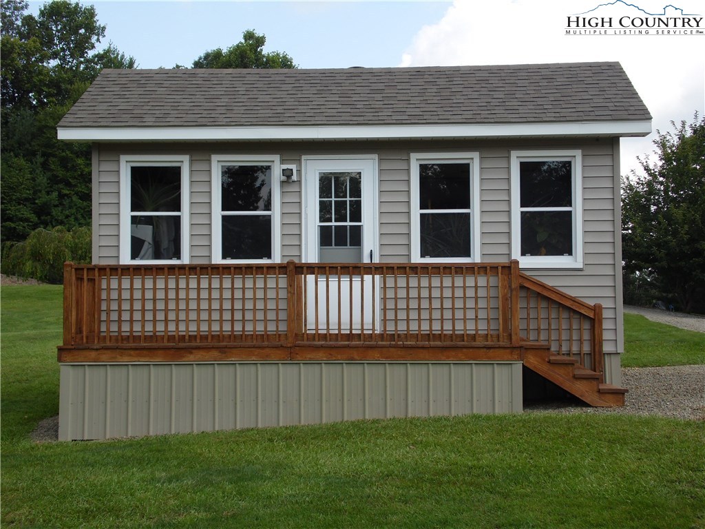 528 Stewart Road Ennice, NC 28623 - Photo 6 of 46 a view of a house with a yard