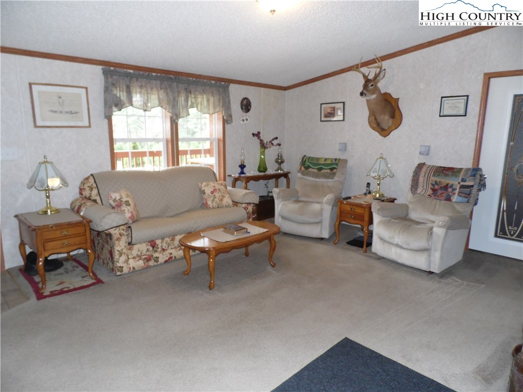 528 Stewart Road Ennice, NC 28623 - Photo 10 of 46 a living room with furniture and a window