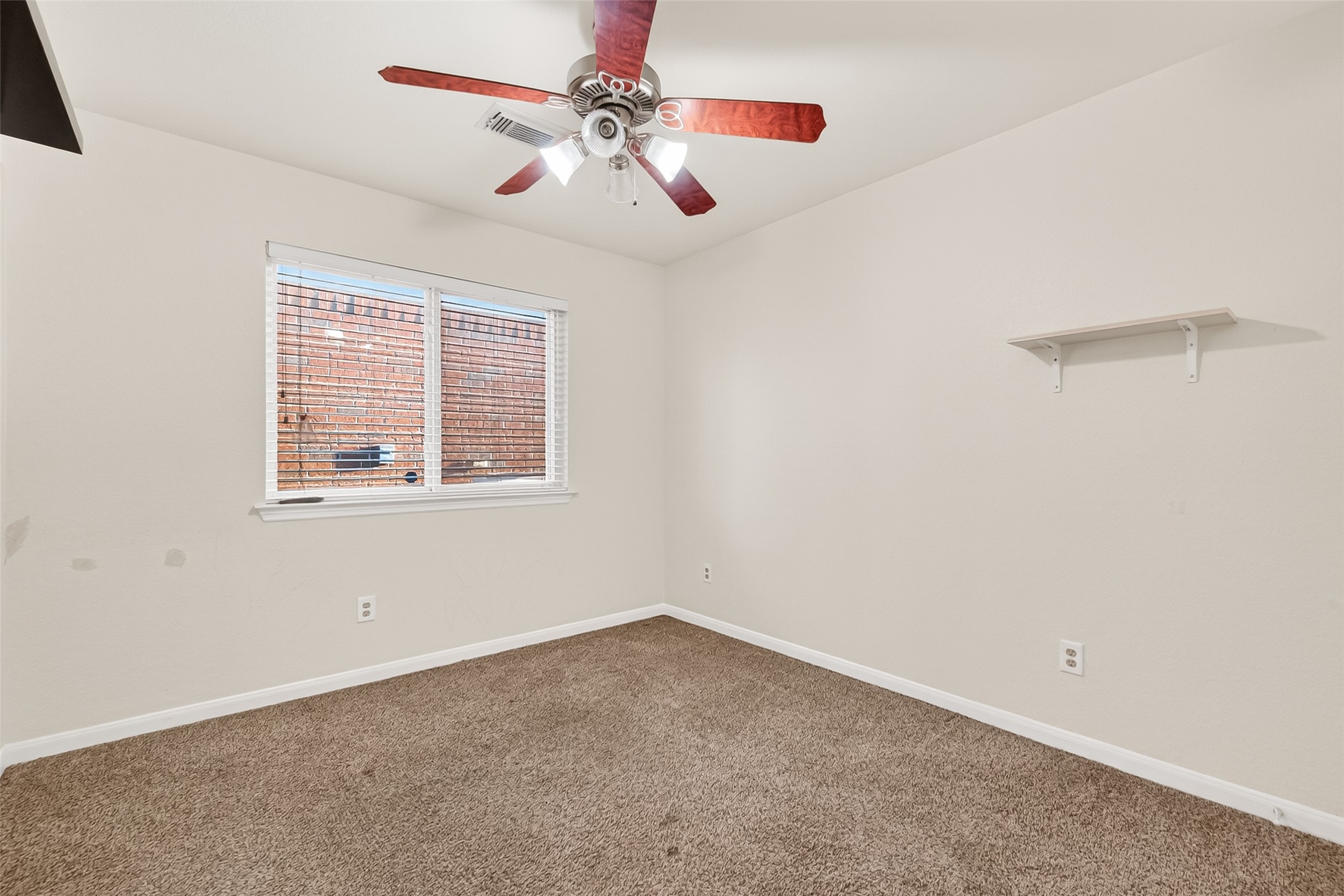 16715 Mackenzie Mesa Drive Spring, TX 77379 - Photo 32 of 50 a view of an empty room with a window