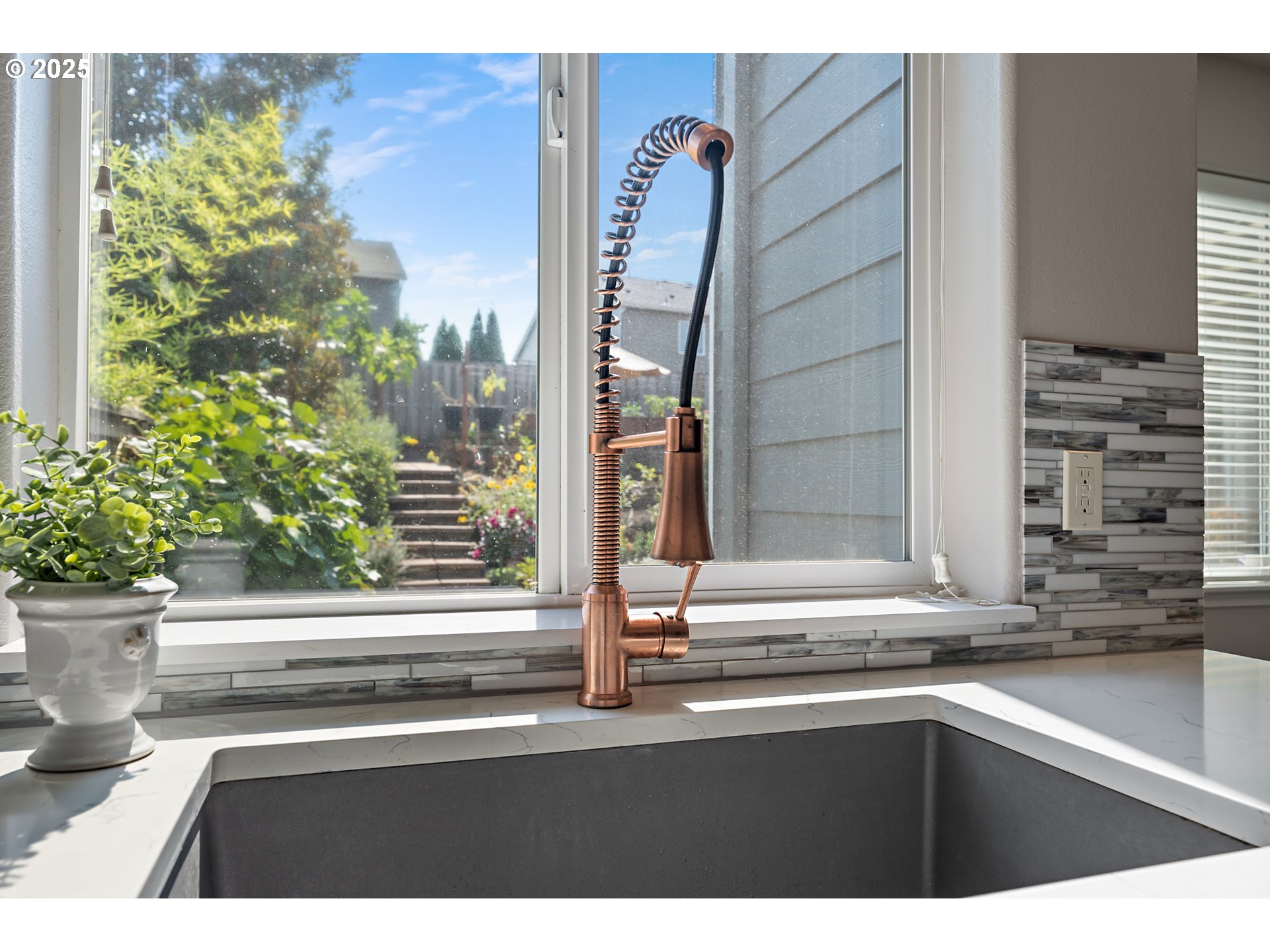 15702 Southwest Snowy Owl Lane Beaverton, OR 97007 - Photo 13 of 44 a view of a sink and a window