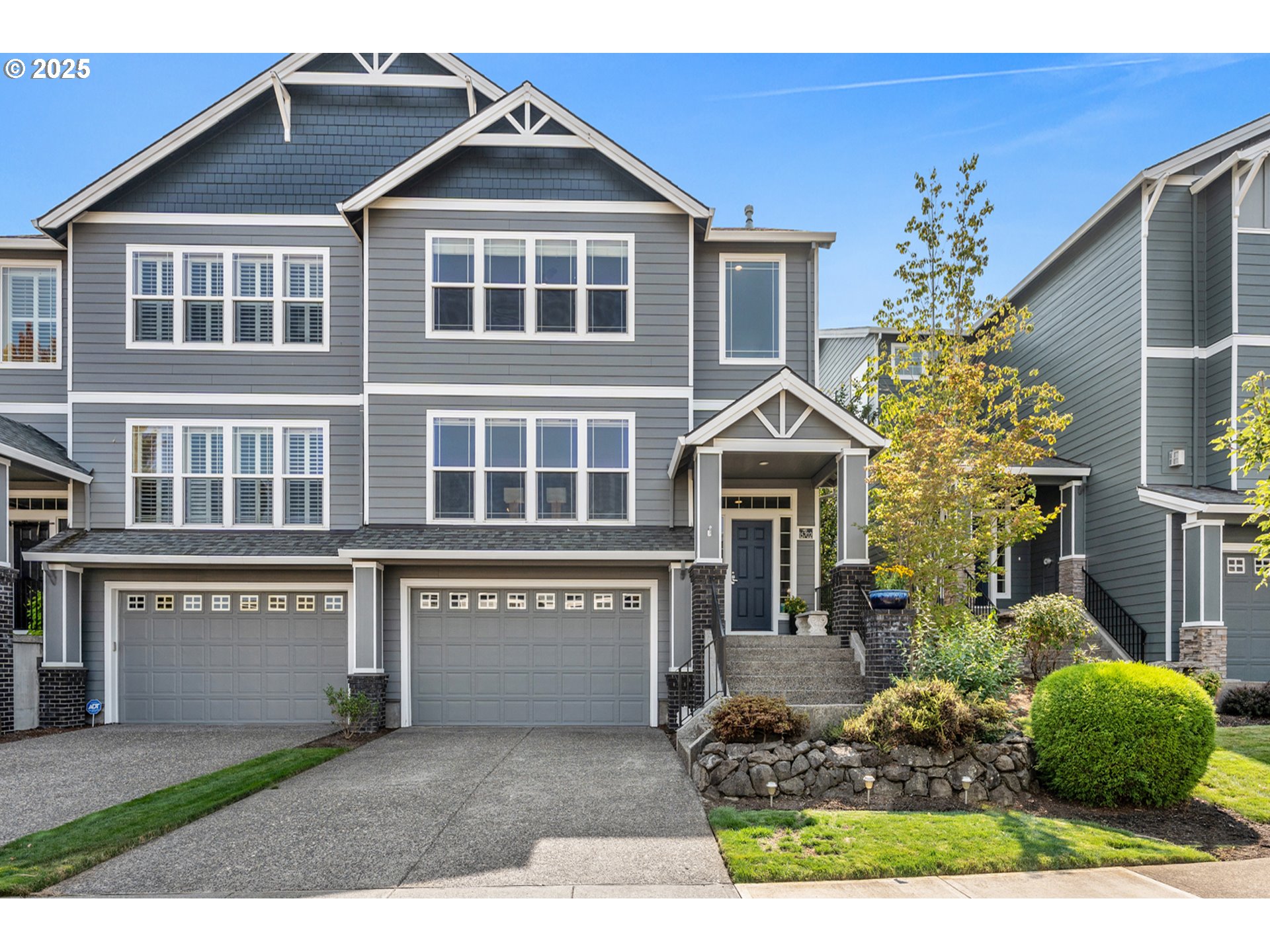 15702 Southwest Snowy Owl Lane Beaverton, OR 97007 - Photo 2 of 44 a front view of a house with a yard