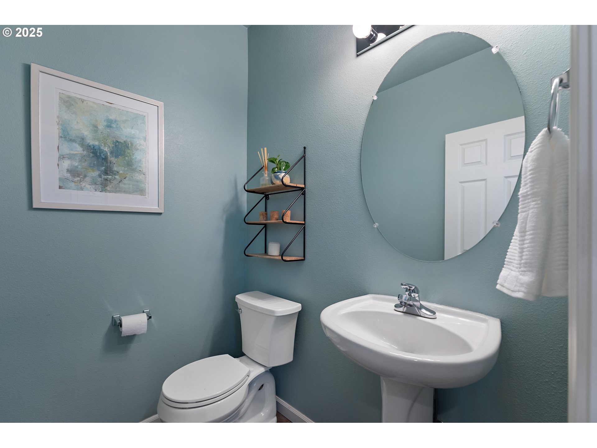 15702 Southwest Snowy Owl Lane Beaverton, OR 97007 - Photo 24 of 44 a bathroom with a toilet sink and mirror