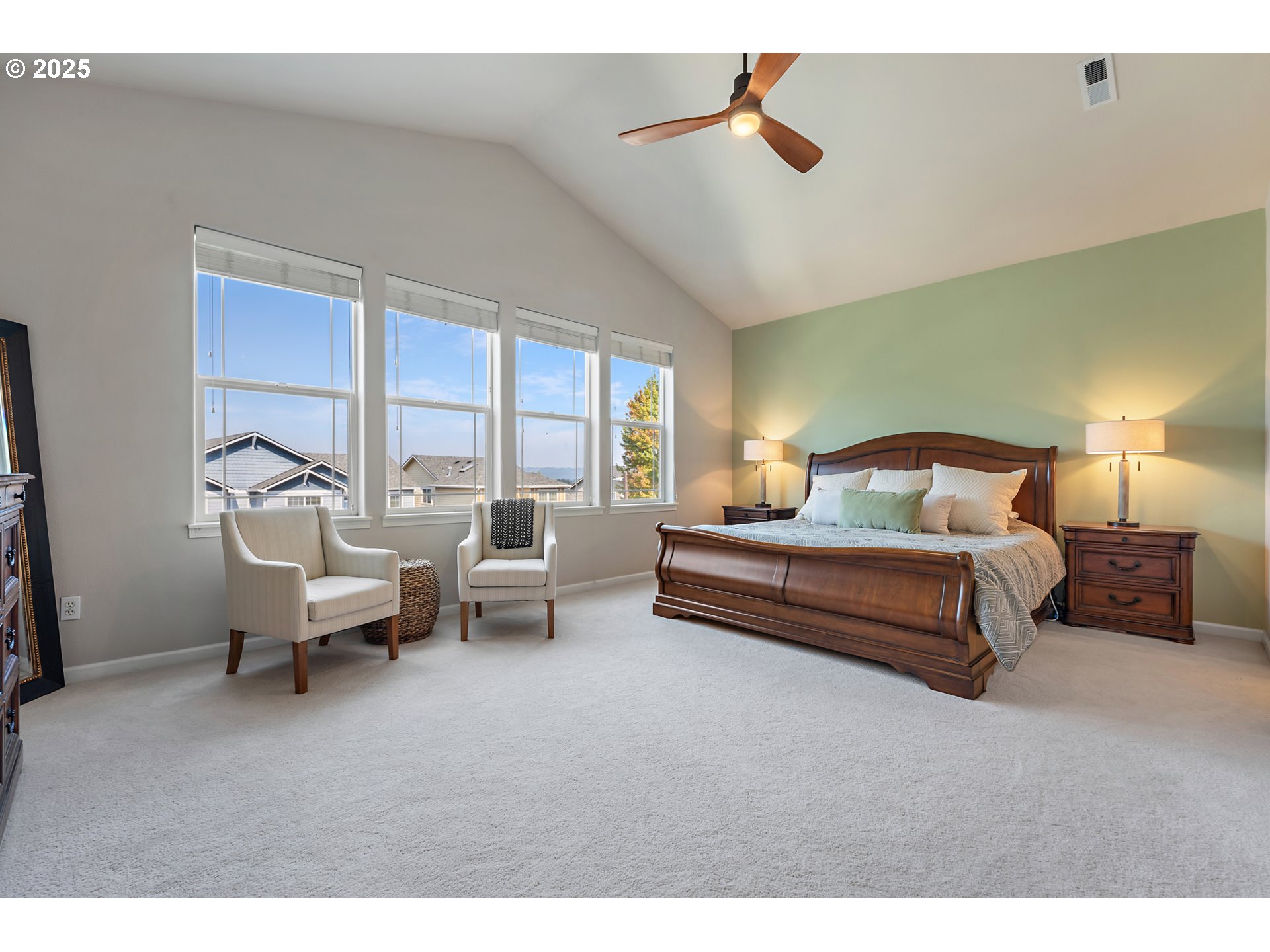 15702 Southwest Snowy Owl Lane Beaverton, OR 97007 - Photo 27 of 44 a bedroom with furniture and a large window