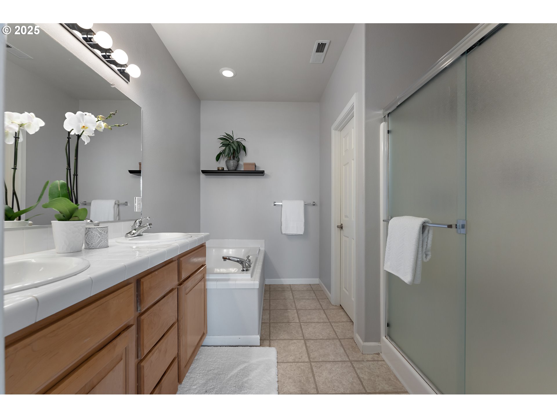 15702 Southwest Snowy Owl Lane Beaverton, OR 97007 - Photo 30 of 44 a bathroom with a sink a toilet and shower