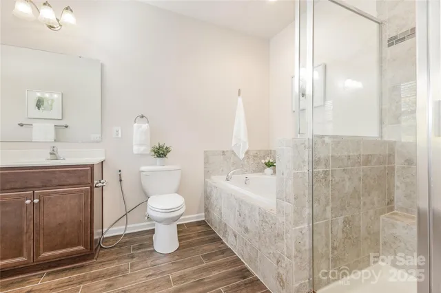a bathroom with a sink mirror and toilet