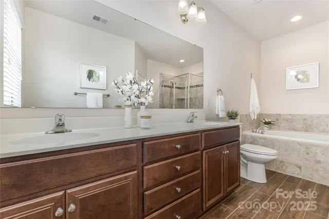 an aerial view of a residential houses with outdoor space