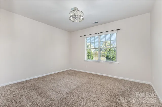 a view of a yard and basketball court