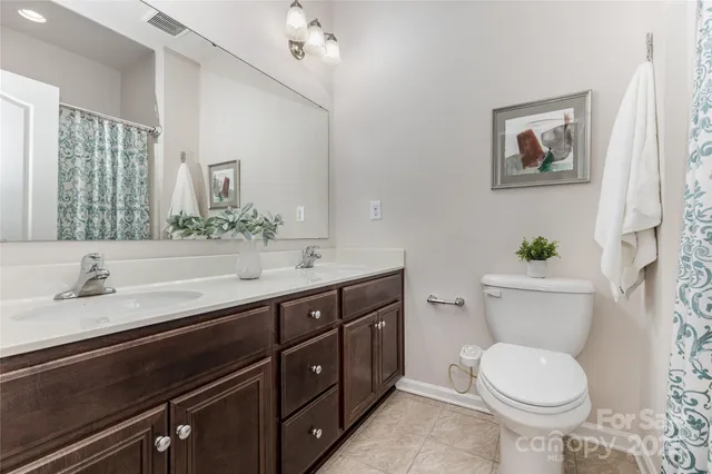 an aerial view of a houses with yard