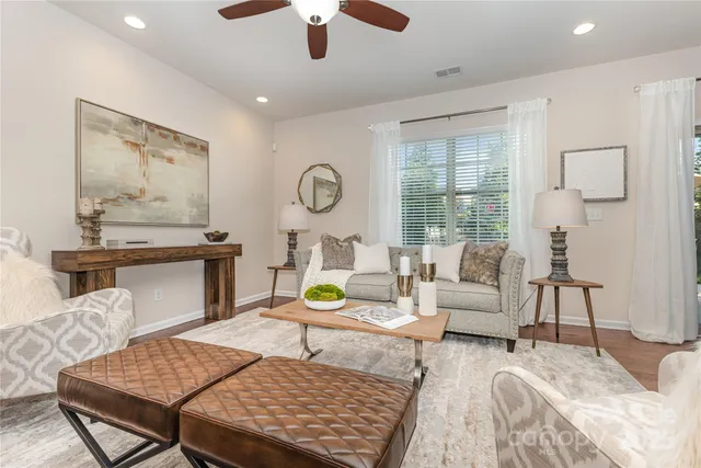 a living room with furniture and a table