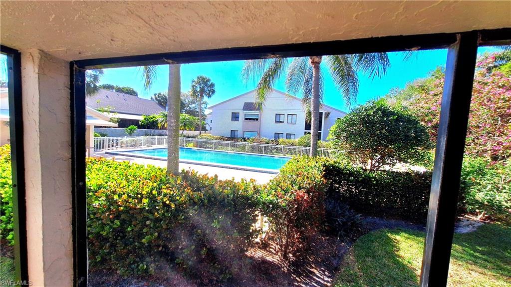 910 Vanderbilt Beach Road, Unit 416E Naples, FL 34108 - Photo 3 of 16 a view of swimming pool from a balcony