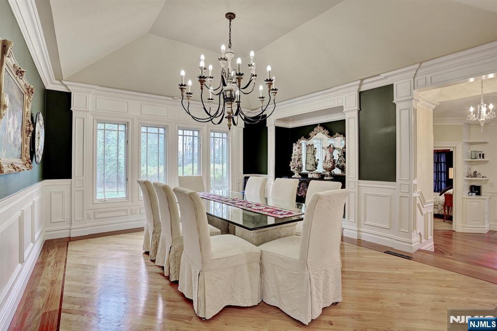 4 Summertree Way Montvale, NJ 07645 - Photo 12 of 50 a view of a dining room with furniture wooden floor and chandelier