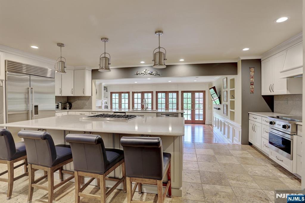 4 Summertree Way Montvale, NJ 07645 - Photo 14 of 50 a large kitchen with kitchen island a island in the center