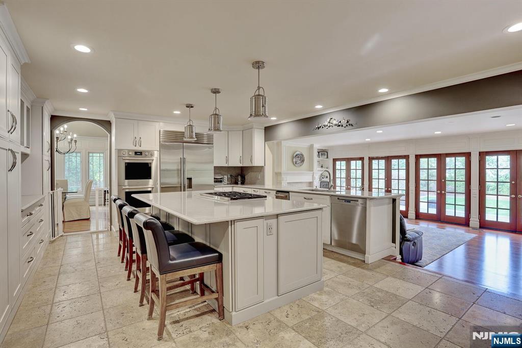 4 Summertree Way Montvale, NJ 07645 - Photo 15 of 50 a kitchen with a table and chairs in it