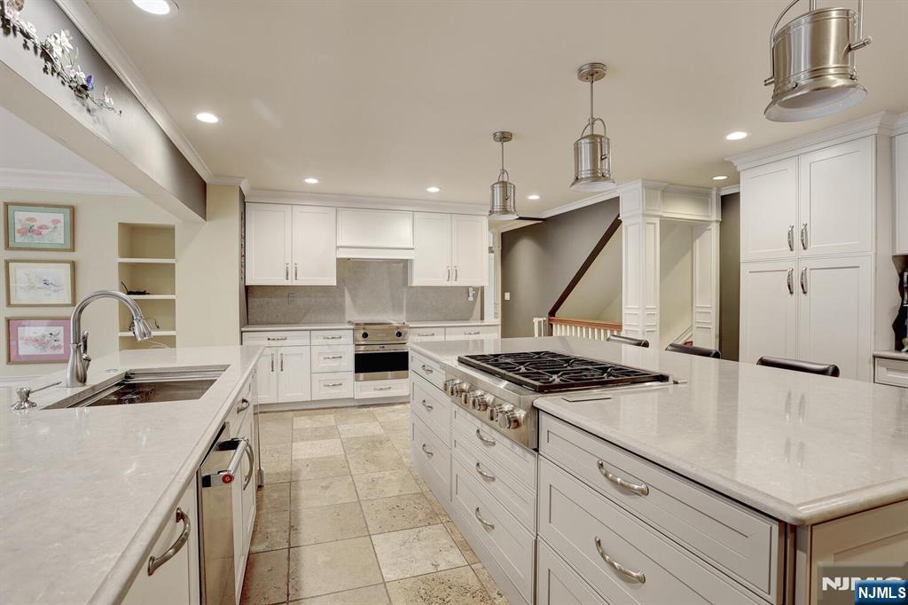 4 Summertree Way Montvale, NJ 07645 - Photo 18 of 50 a kitchen with stainless steel appliances granite countertop a sink stove and refrigerator