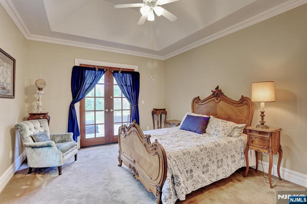 4 Summertree Way Montvale, NJ 07645 - Photo 22 of 50 a bedroom with a bed and a window