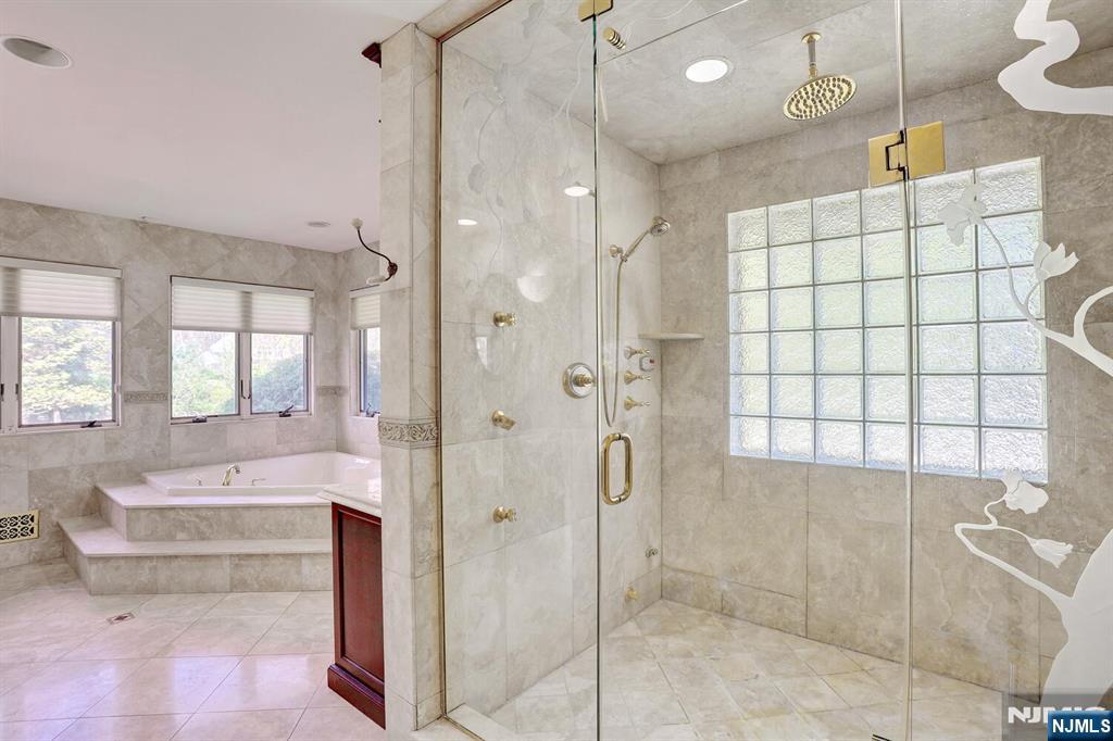 4 Summertree Way Montvale, NJ 07645 - Photo 27 of 50 a spacious bathroom with a shower and a sink
