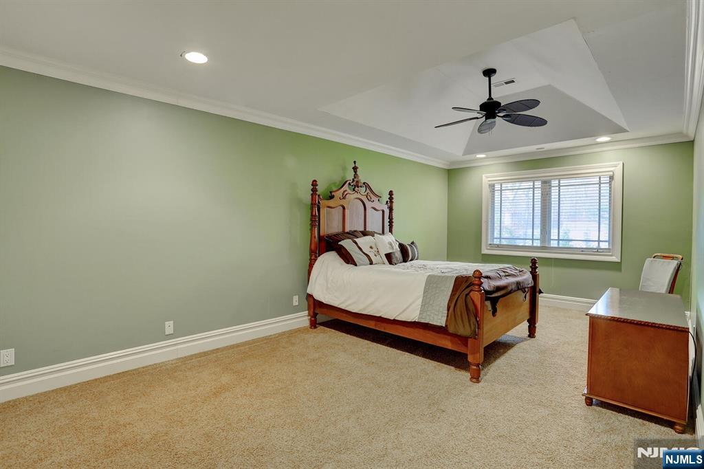 4 Summertree Way Montvale, NJ 07645 - Photo 28 of 50 a bed room with a bed and furniture