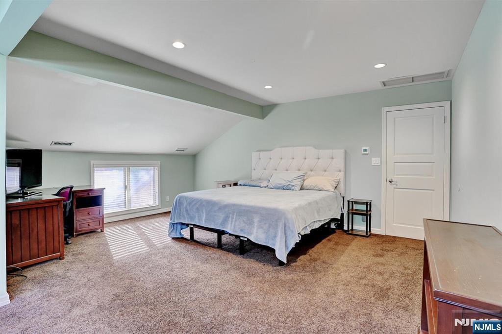 4 Summertree Way Montvale, NJ 07645 - Photo 30 of 50 a spacious bedroom with a bed and furniture