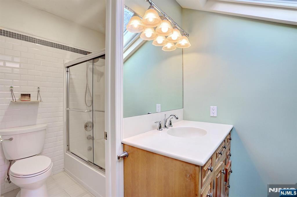 4 Summertree Way Montvale, NJ 07645 - Photo 31 of 50 a bathroom with a sink toilet and shower